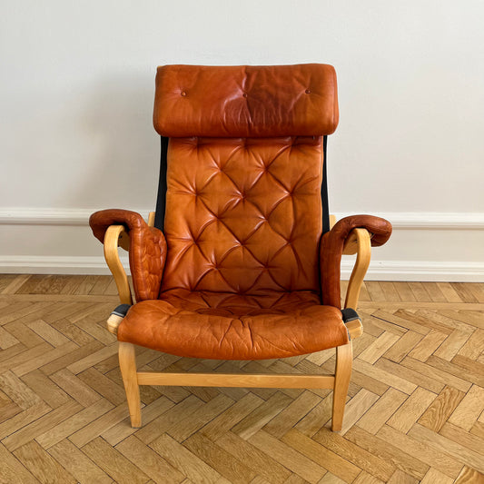 Pernilla 69 lounge chair, by Bruno Mathsson with brown leather and black canvas for DUX