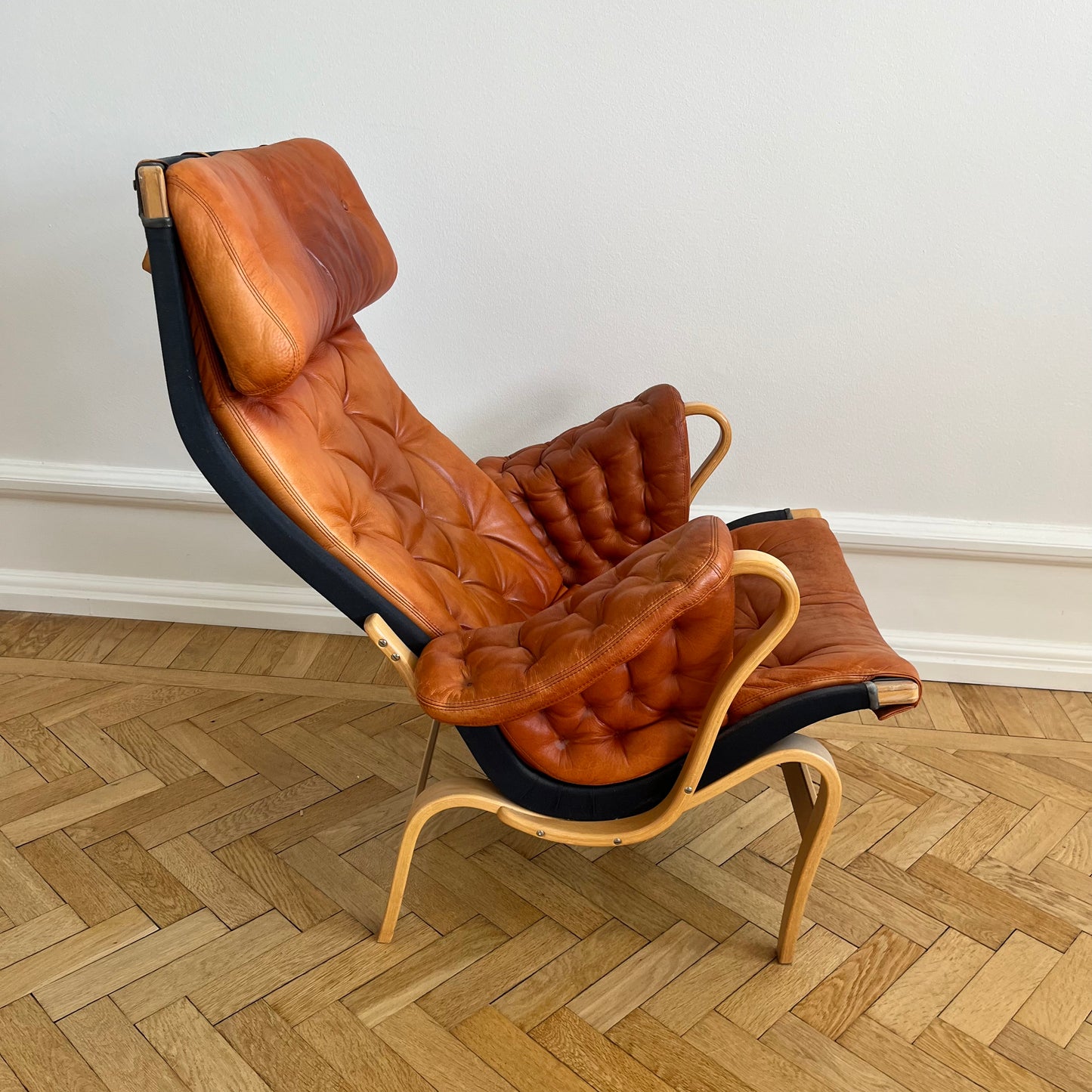 Pernilla 69 lounge chair, by Bruno Mathsson with brown leather and black canvas for DUX