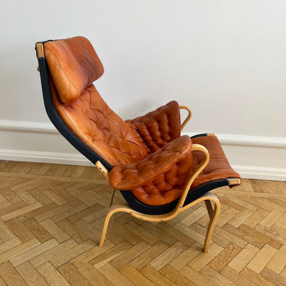 Pernilla 69 lounge chair, by Bruno Mathsson with brown leather and black canvas for DUX