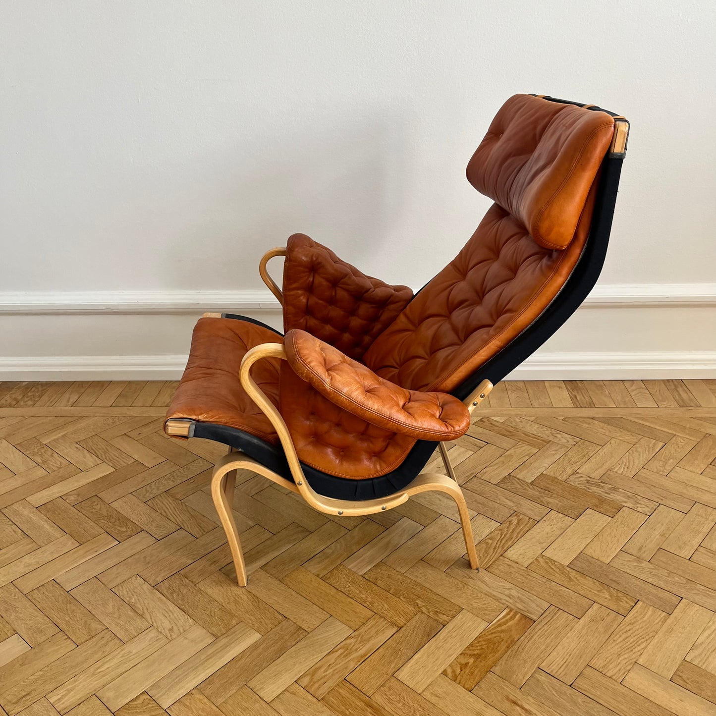 Pernilla 69 lounge chair, by Bruno Mathsson with brown leather and black canvas for DUX