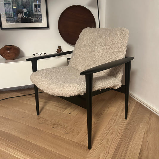 Danish 1950s lounge chair in matt black finish and teddy cover