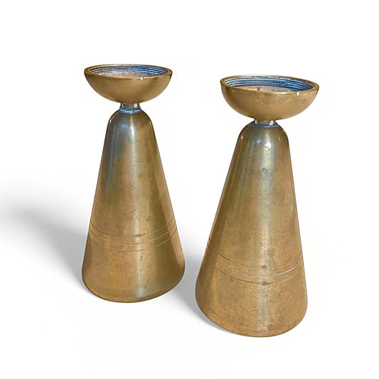 A pair of brass assumed candle holders